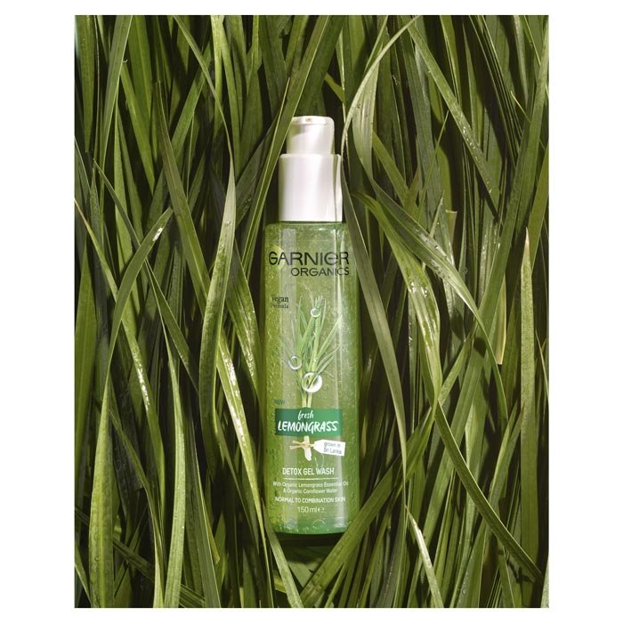 Garnier Organics Lemongrass Detox Gel Wash product laying in lemongrass